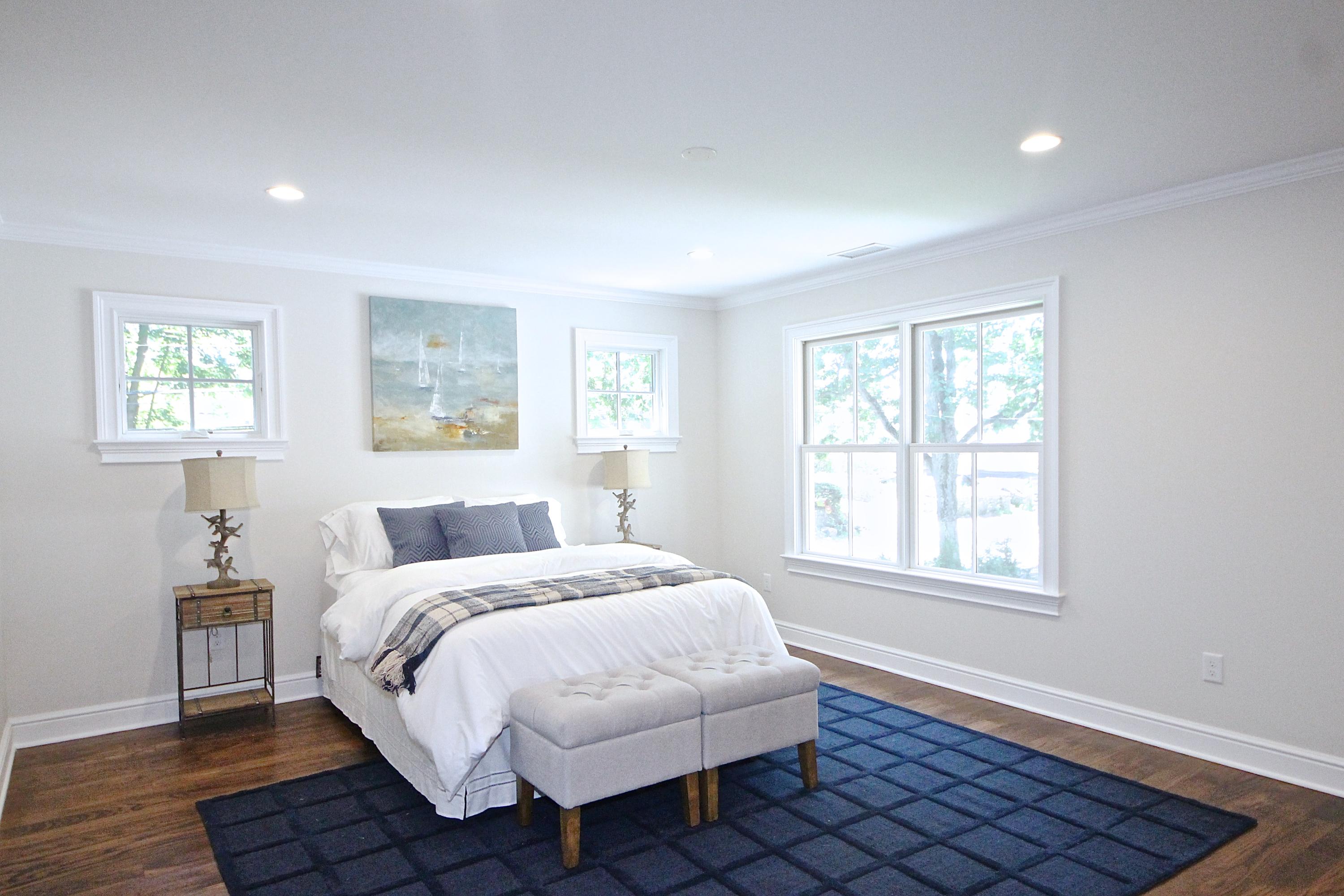 38 Old Parish Road Darien, CT 06820 - Photo 17 of 31 a bedroom with a bed wooden floor and window