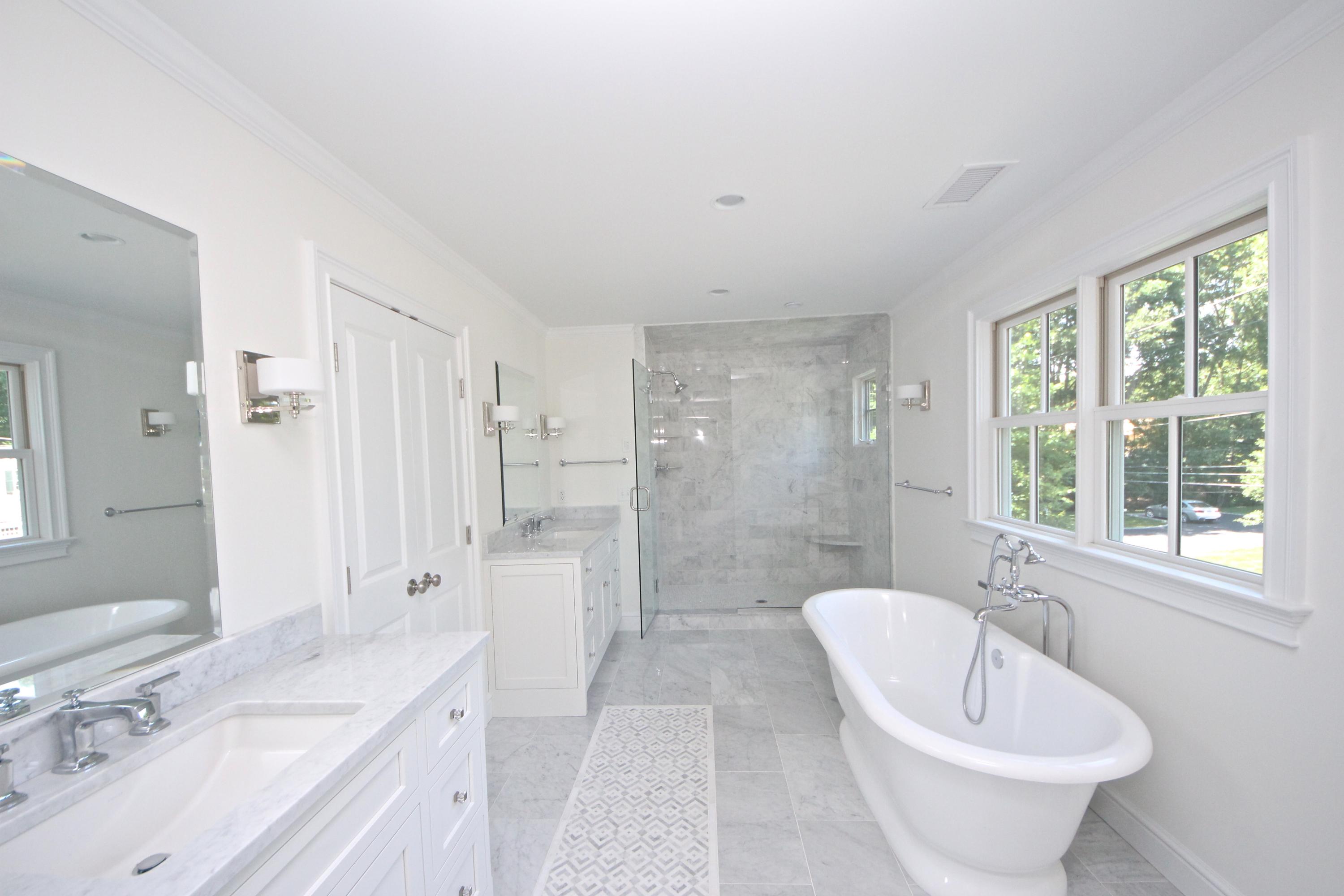 38 Old Parish Road Darien, CT 06820 - Photo 18 of 31 a bathroom with a bathtub shower sink and mirror