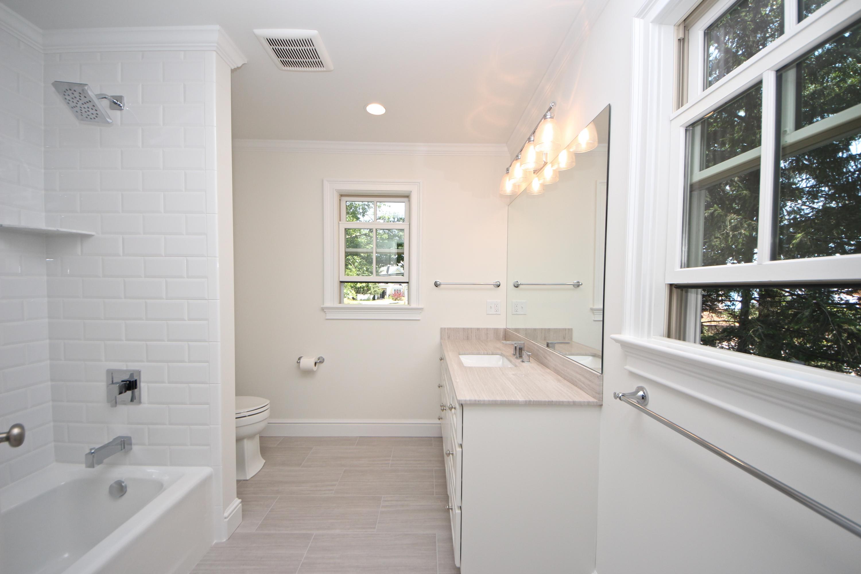 38 Old Parish Road Darien, CT 06820 - Photo 22 of 31 a bathroom with a sink a bathtub and a shower