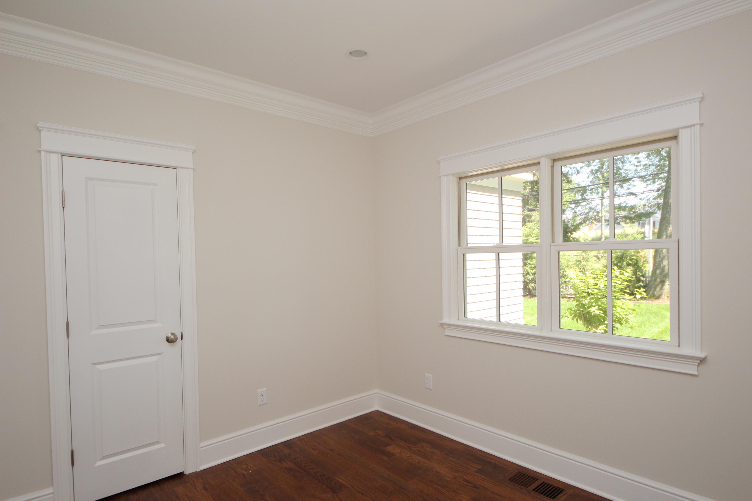 38 Old Parish Road Darien, CT 06820 - Photo 24 of 31 an empty room with wooden floor and windows