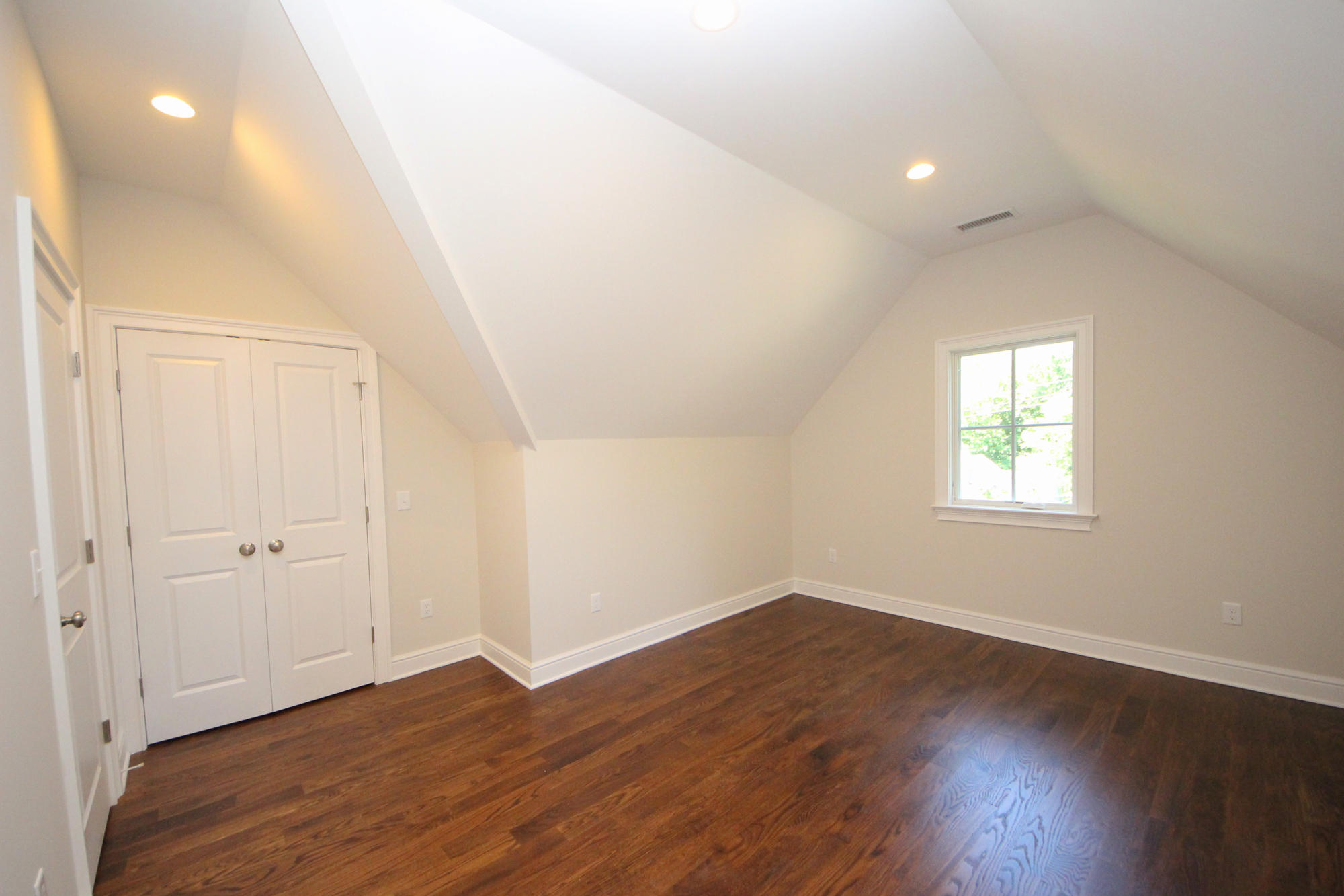 38 Old Parish Road Darien, CT 06820 - Photo 25 of 31 an empty room with wooden floor and windows