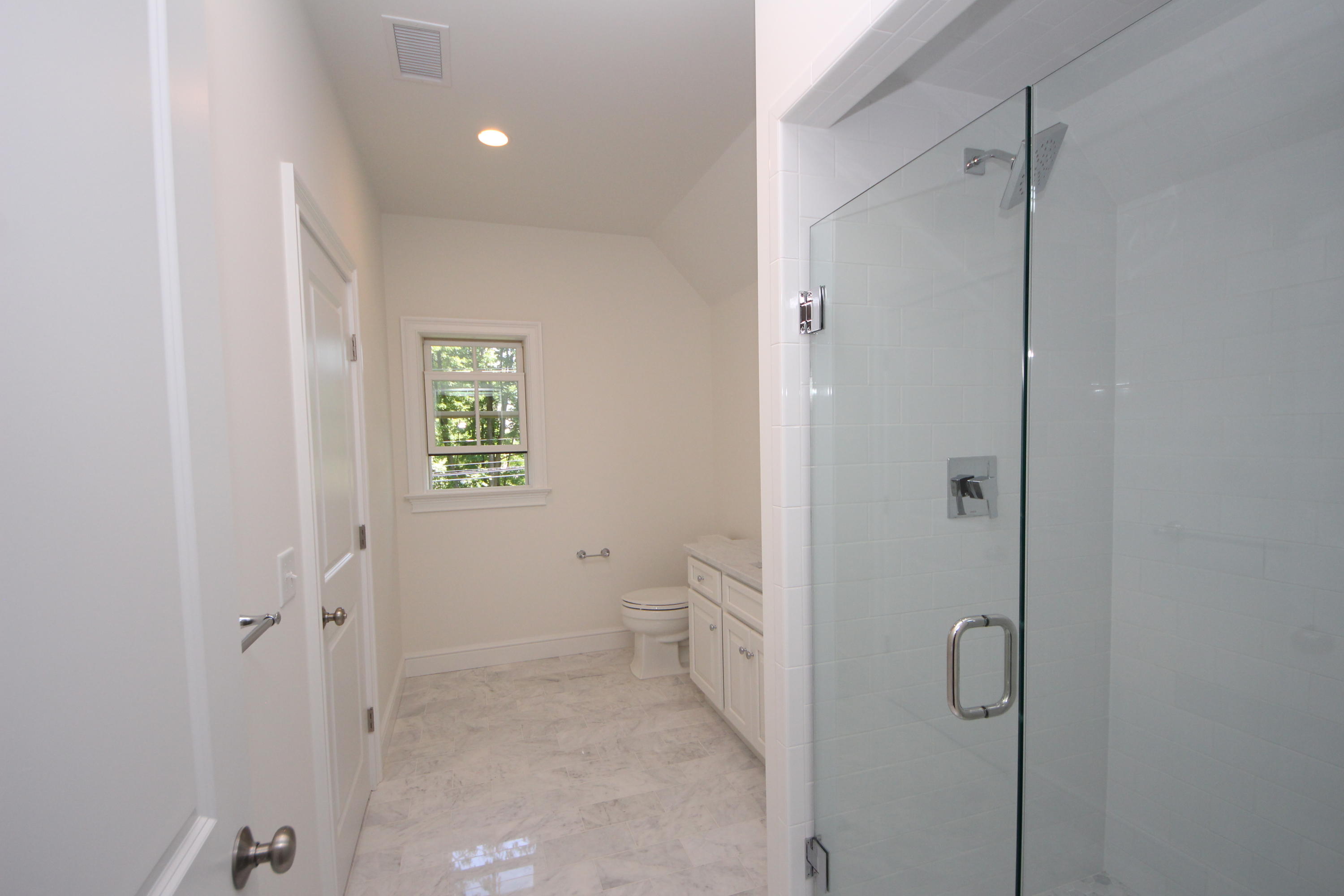 38 Old Parish Road Darien, CT 06820 - Photo 26 of 31 a bathroom with a granite countertop toilet a sink and shower