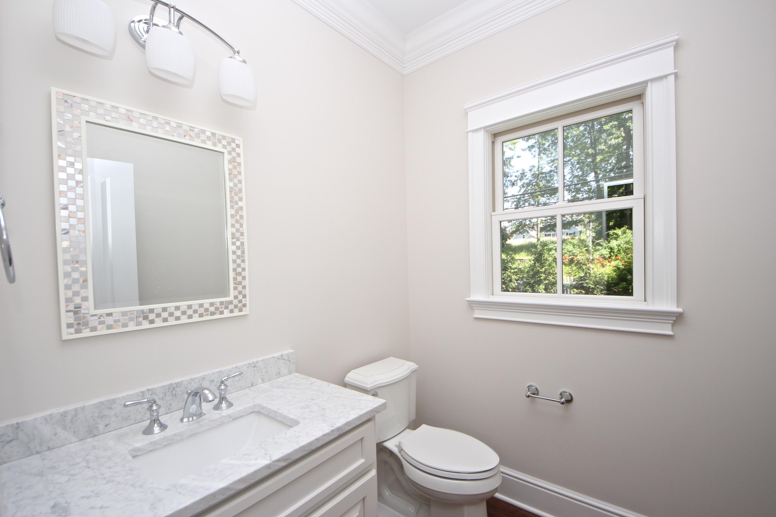 38 Old Parish Road Darien, CT 06820 - Photo 27 of 31 a bathroom with a granite countertop sink mirror vanity and toilet
