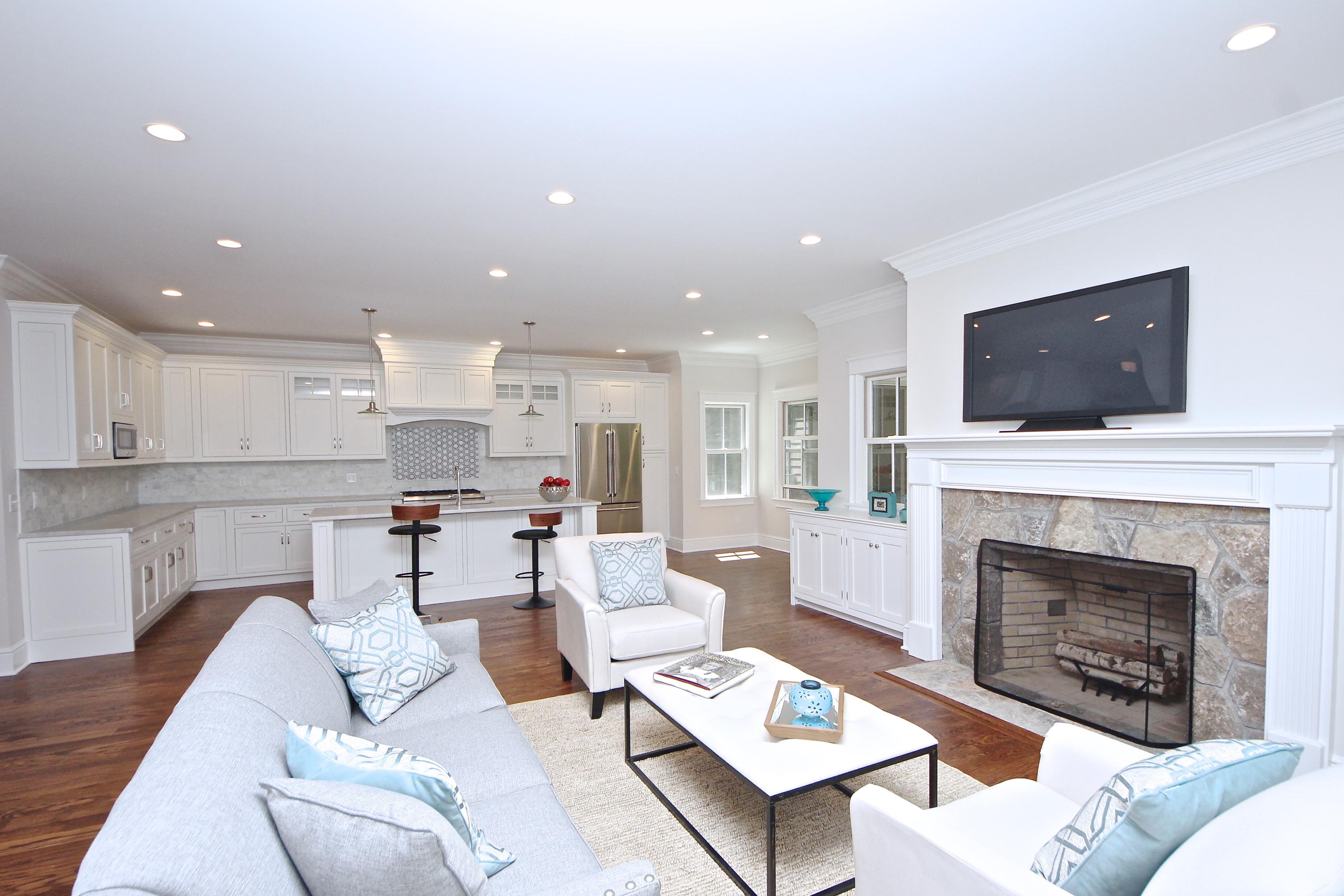 38 Old Parish Road Darien, CT 06820 - Photo 10 of 31 a living room with furniture a fireplace and a flat screen tv