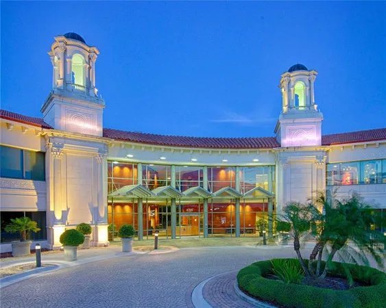 a front view of building with yard