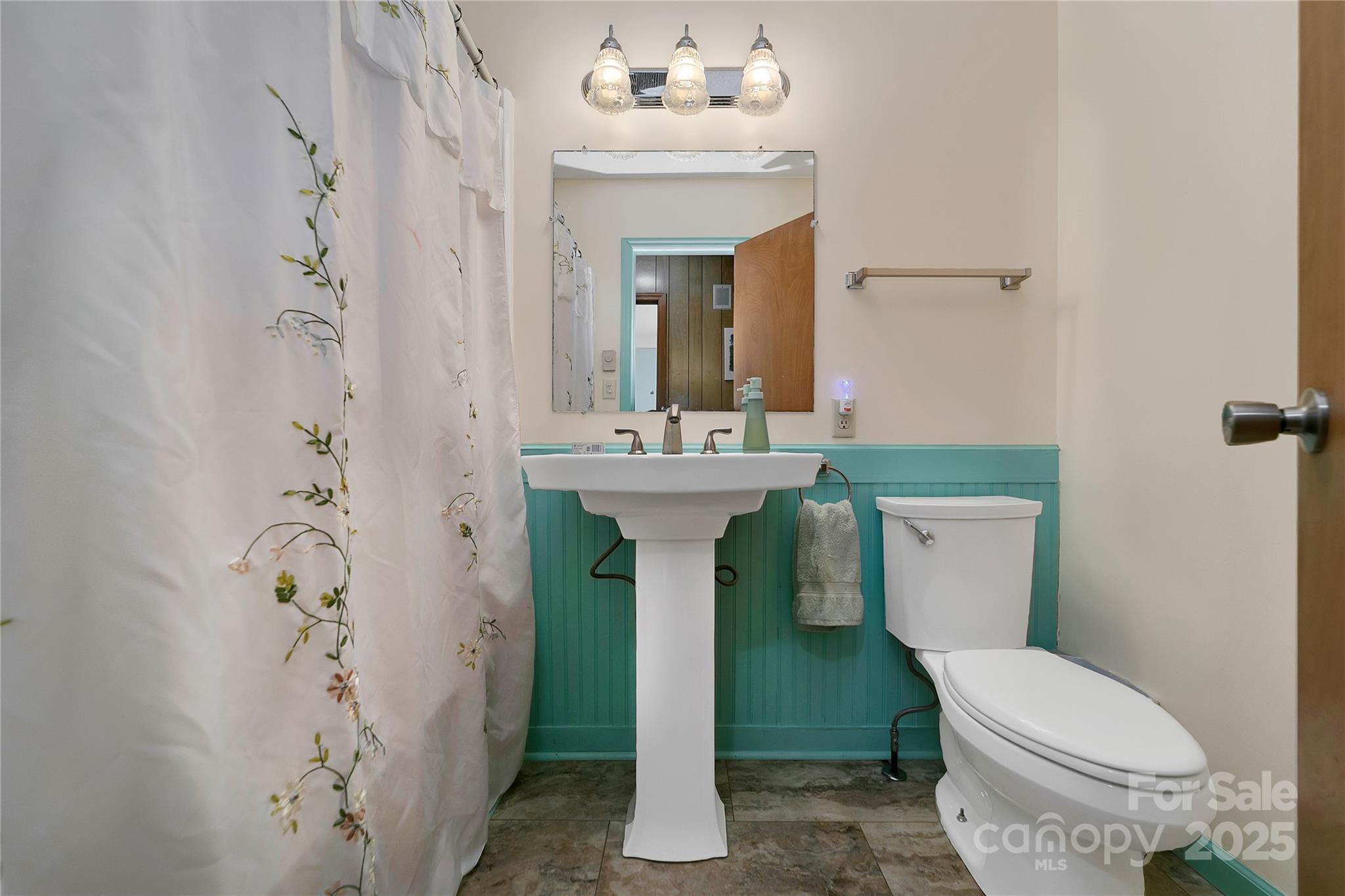 177 Walelu Court Brevard, NC 28712 - Photo 12 of 26 a bathroom with a sink toilet and shower