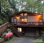 a front view of a house with yard and seating area
