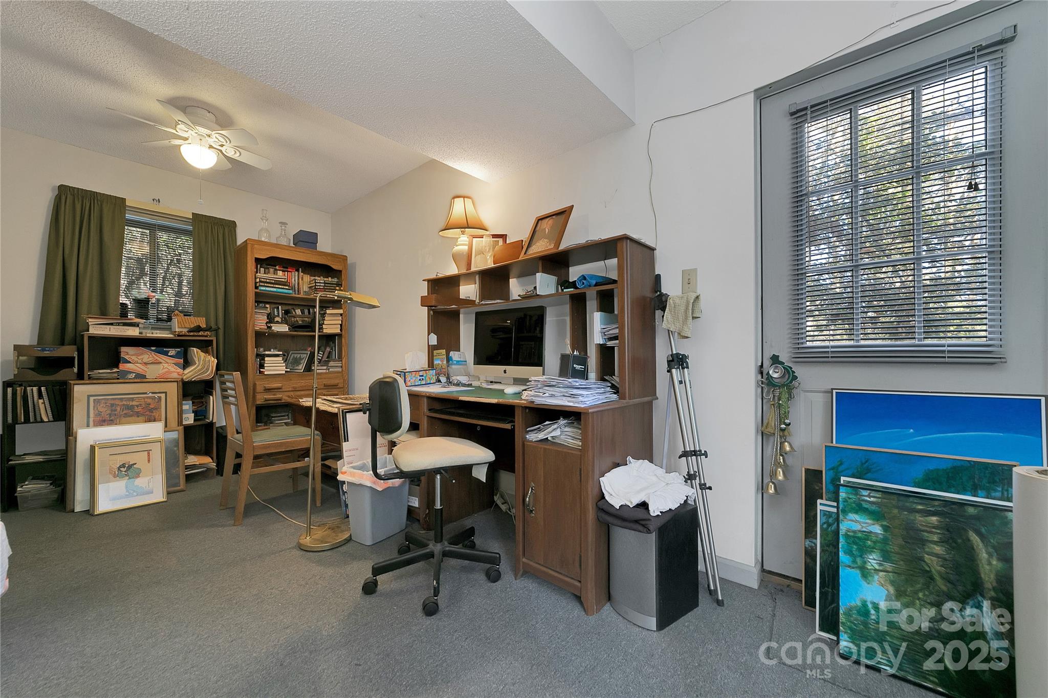 177 Walelu Court Brevard, NC 28712 - Photo 21 of 26 a view of a workspace with furniture and a fireplace