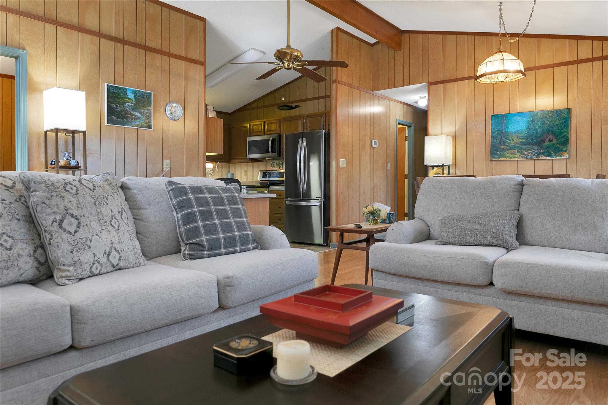 177 Walelu Court Brevard, NC 28712 - Photo 9 of 26 a living room with furniture and a chandelier