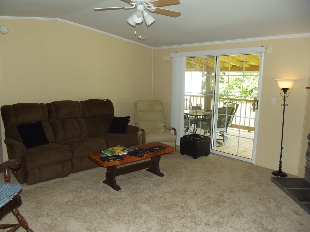 324 Creek Road Spring City, TN 37381 - Photo 6 of 36 living room with view to deck
