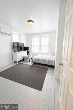 a bed room with a bed and a couch