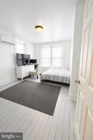 a bed room with a bed and a couch