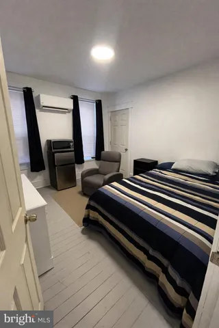 a bedroom with furniture and window