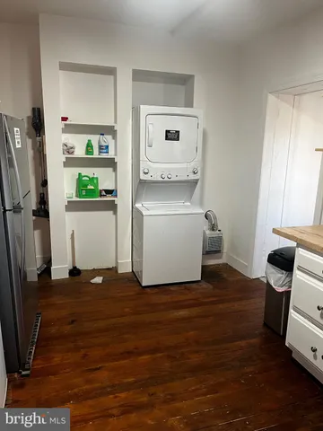 a view of kitchen with furniture and wooden floor