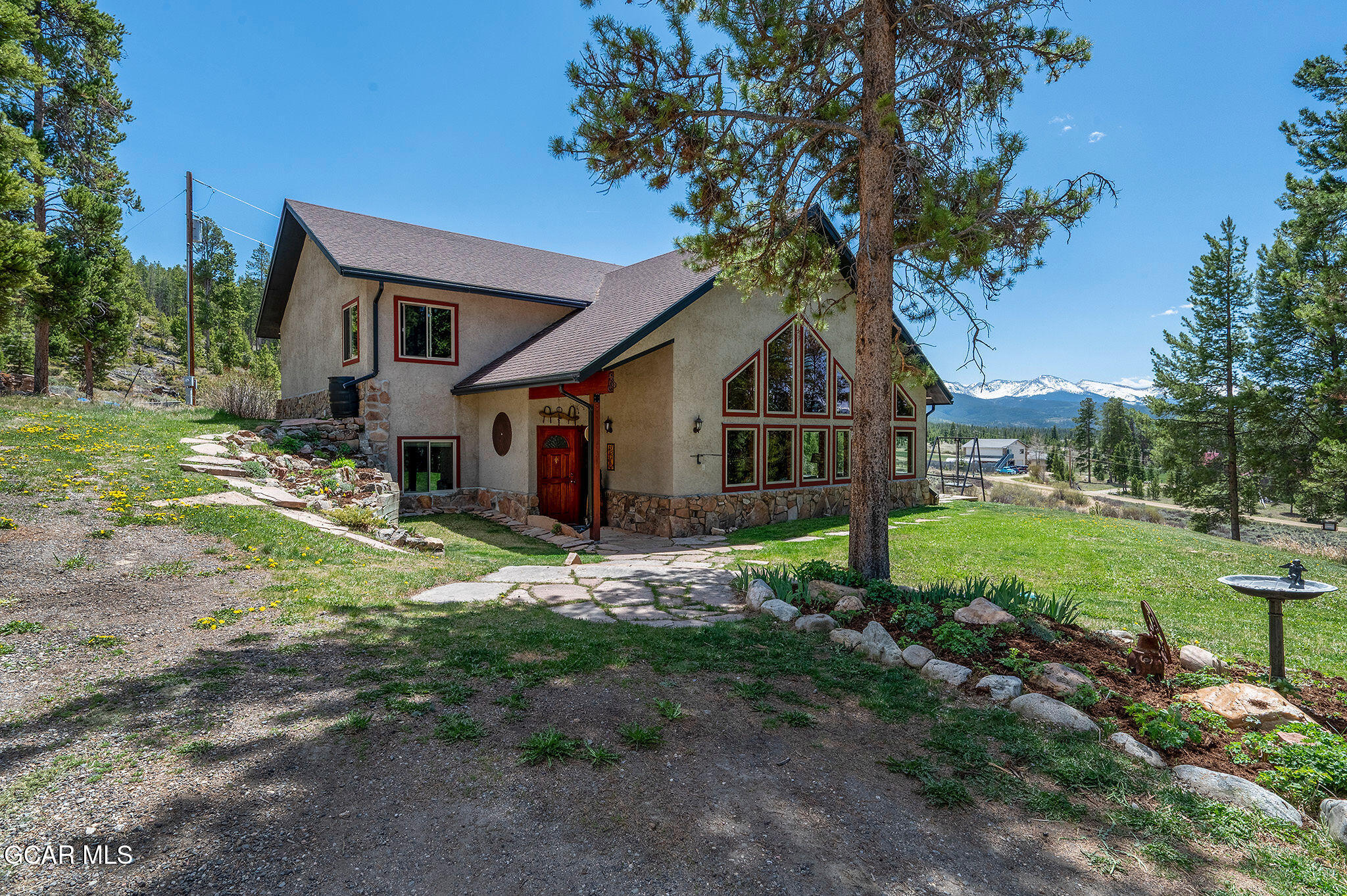 732 Gcr 8311/ Clayton Ranch Road Tabernash, CO 80478 - Photo 21 of 65 a front view of a house with garden