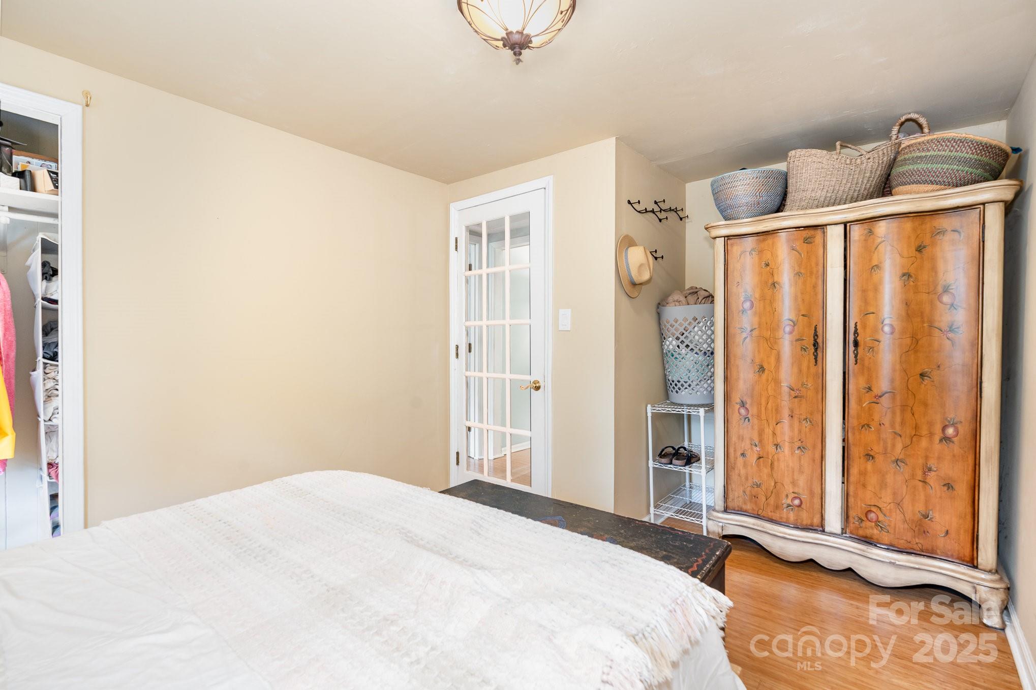 4124 Oakwood Road Charlotte, NC 28269 - Photo 14 of 20 a bedroom with a bed and a window