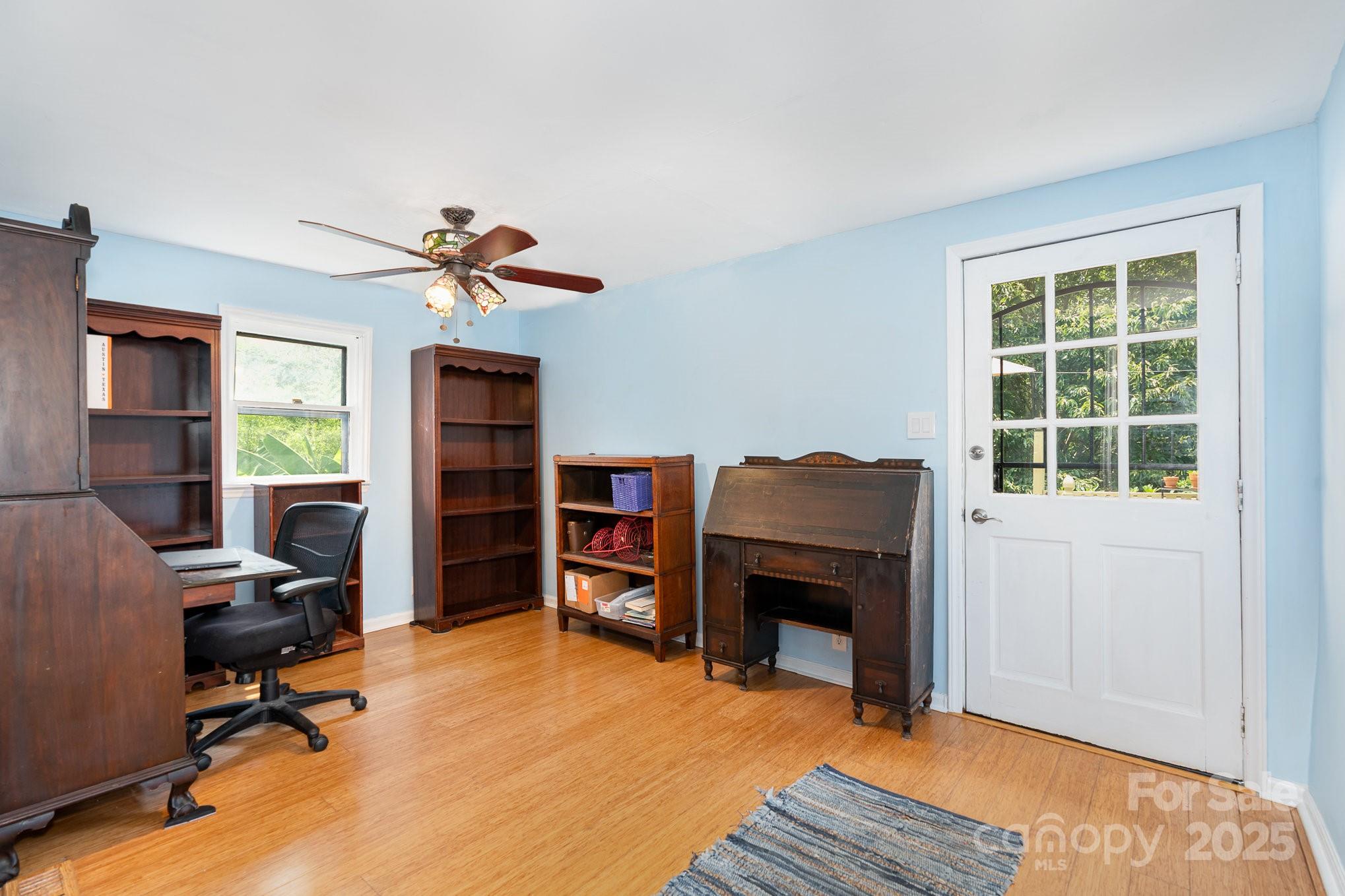 4124 Oakwood Road Charlotte, NC 28269 - Photo 15 of 20 a workspace with furniture hardwood and a window