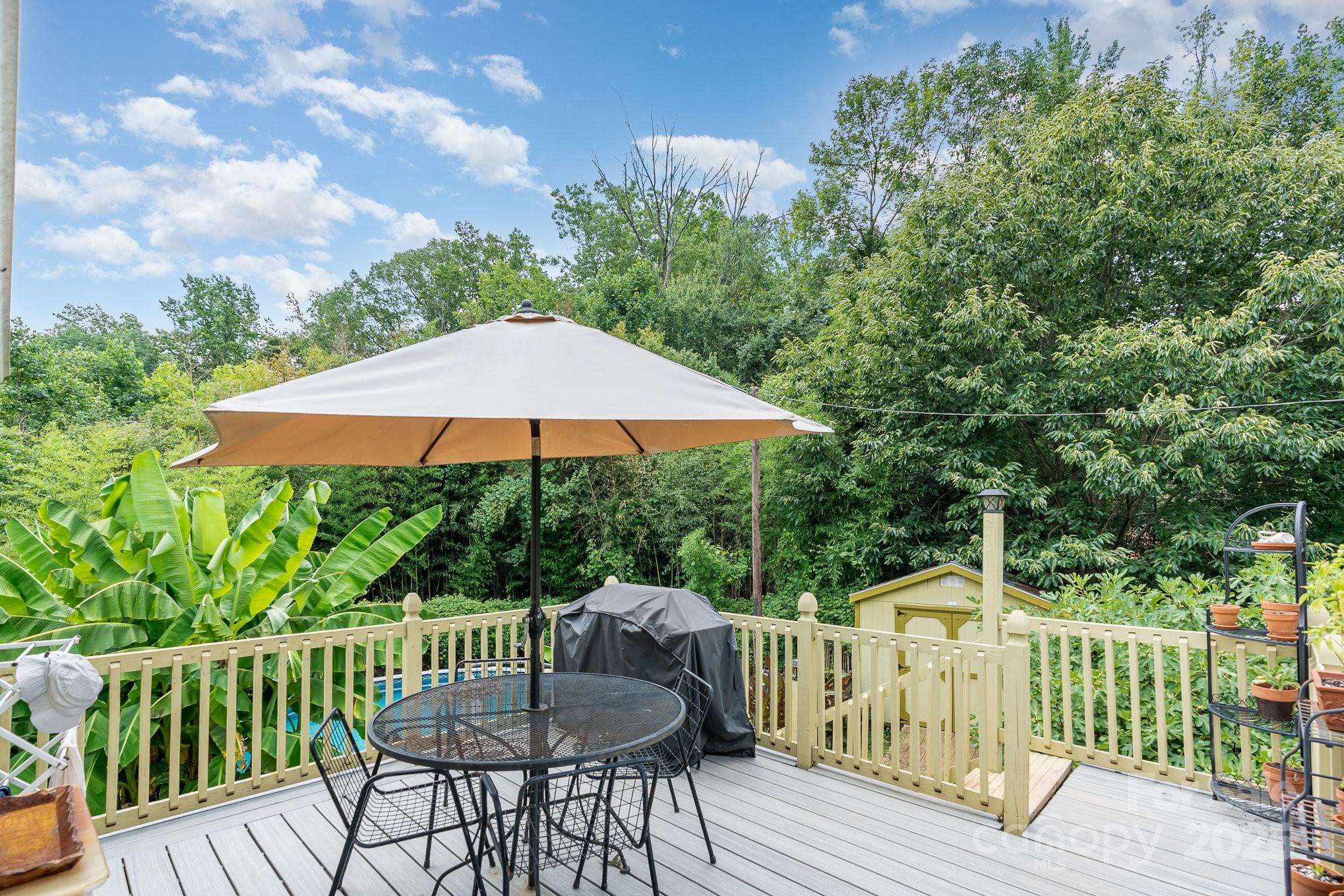4124 Oakwood Road Charlotte, NC 28269 - Photo 18 of 20 a view of table and chair under an umbrella