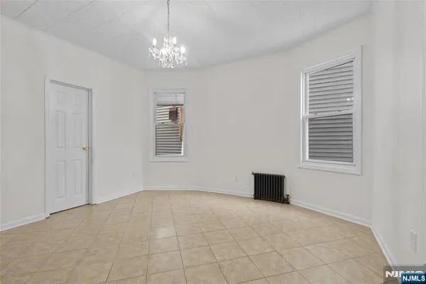 a view of a livingroom with a chandelier fan