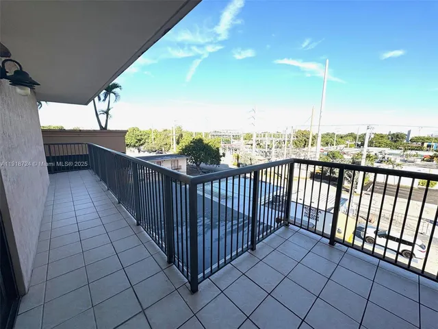 a view of balcony with wooden floor