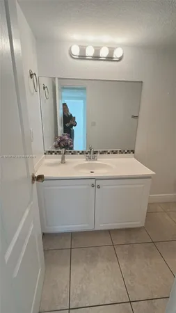 a bathroom with a toilet and a sink