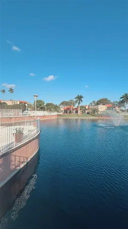 a view of a backyard with sitting area