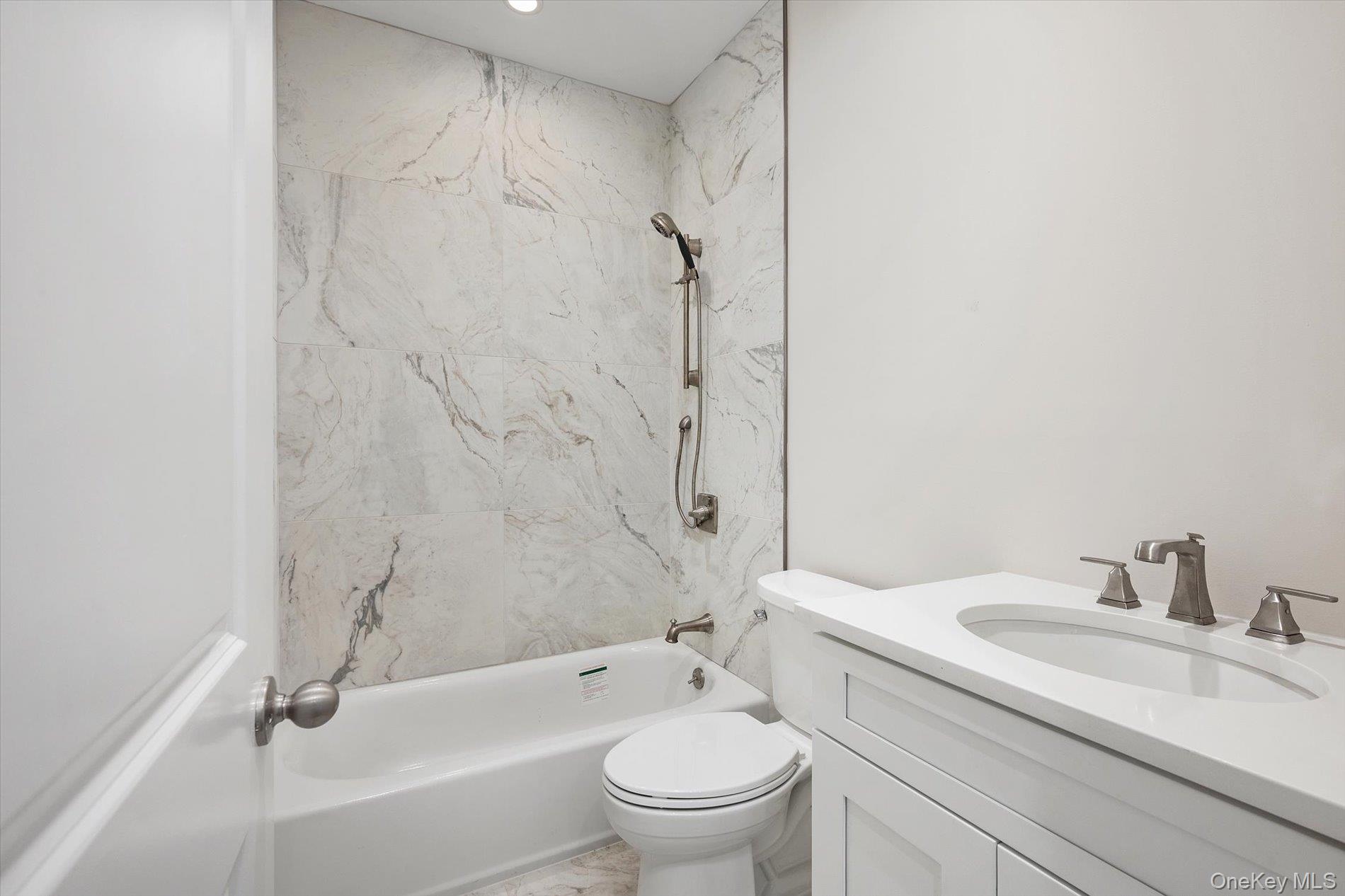 2 Gail-grace Court Copiague, NY 11726 - Photo 18 of 27 Full bath featuring shower / bathtub combination and vanity