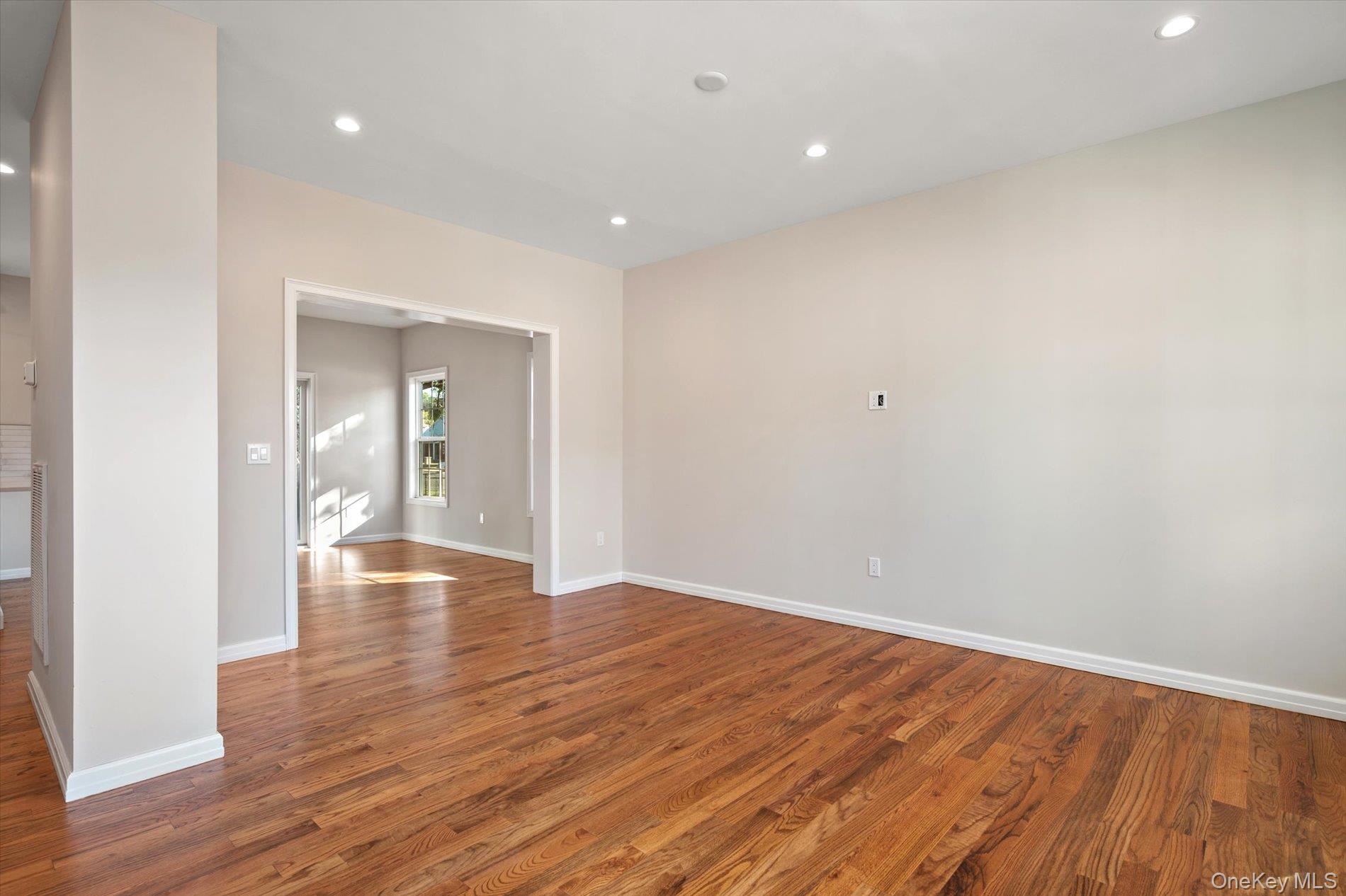 2 Gail-grace Court Copiague, NY 11726 - Photo 6 of 27 Unfurnished room featuring recessed lighting and wood finished floors