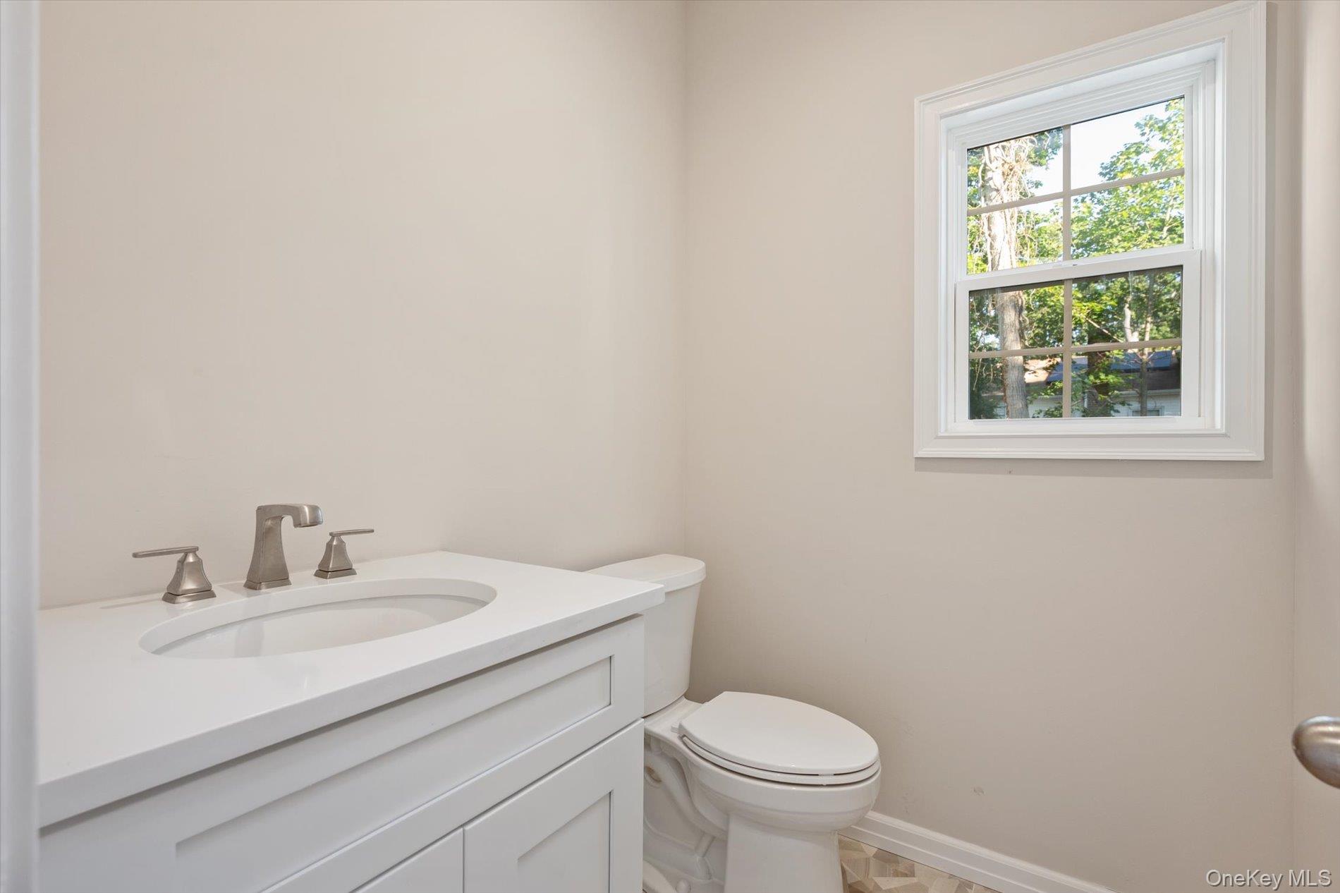 2 Gail-grace Court Copiague, NY 11726 - Photo 8 of 27 Bathroom with vanity and toilet