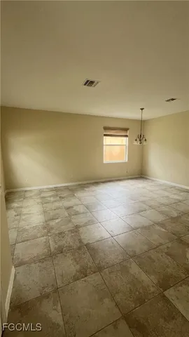 a view of an empty room and window