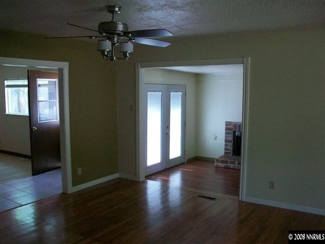 3430 Rauscher Drive Reno, NV 89503 - Photo 6 of 9 wooden floor in an empty room with a window