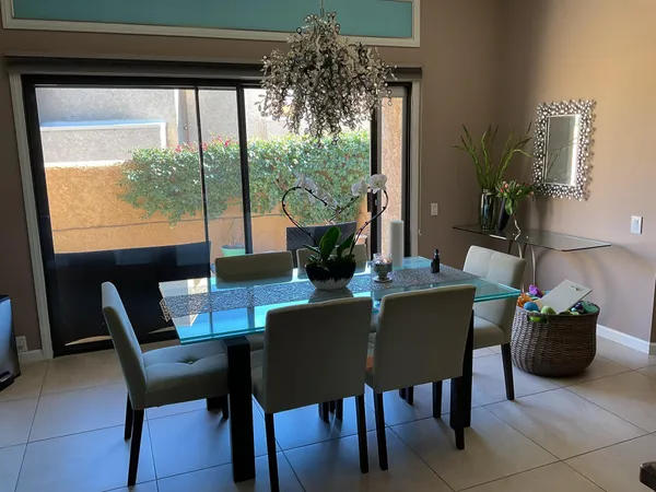a view of a dining room with furniture window and outside view
