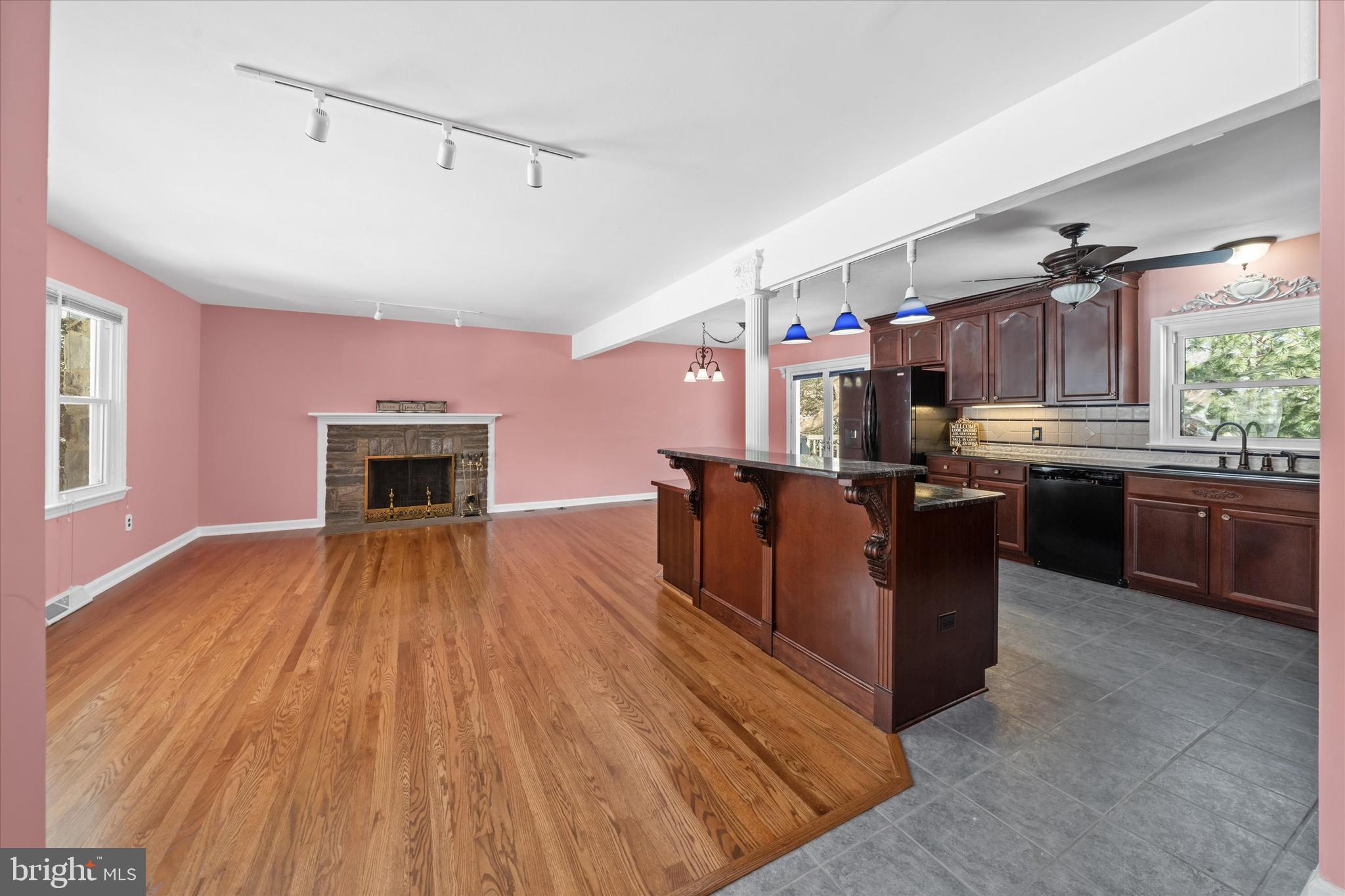 104 Danforth Place Wilmington, DE 19810 - Photo 17 of 53 a open kitchen with cabinets a stove and a wooden floor