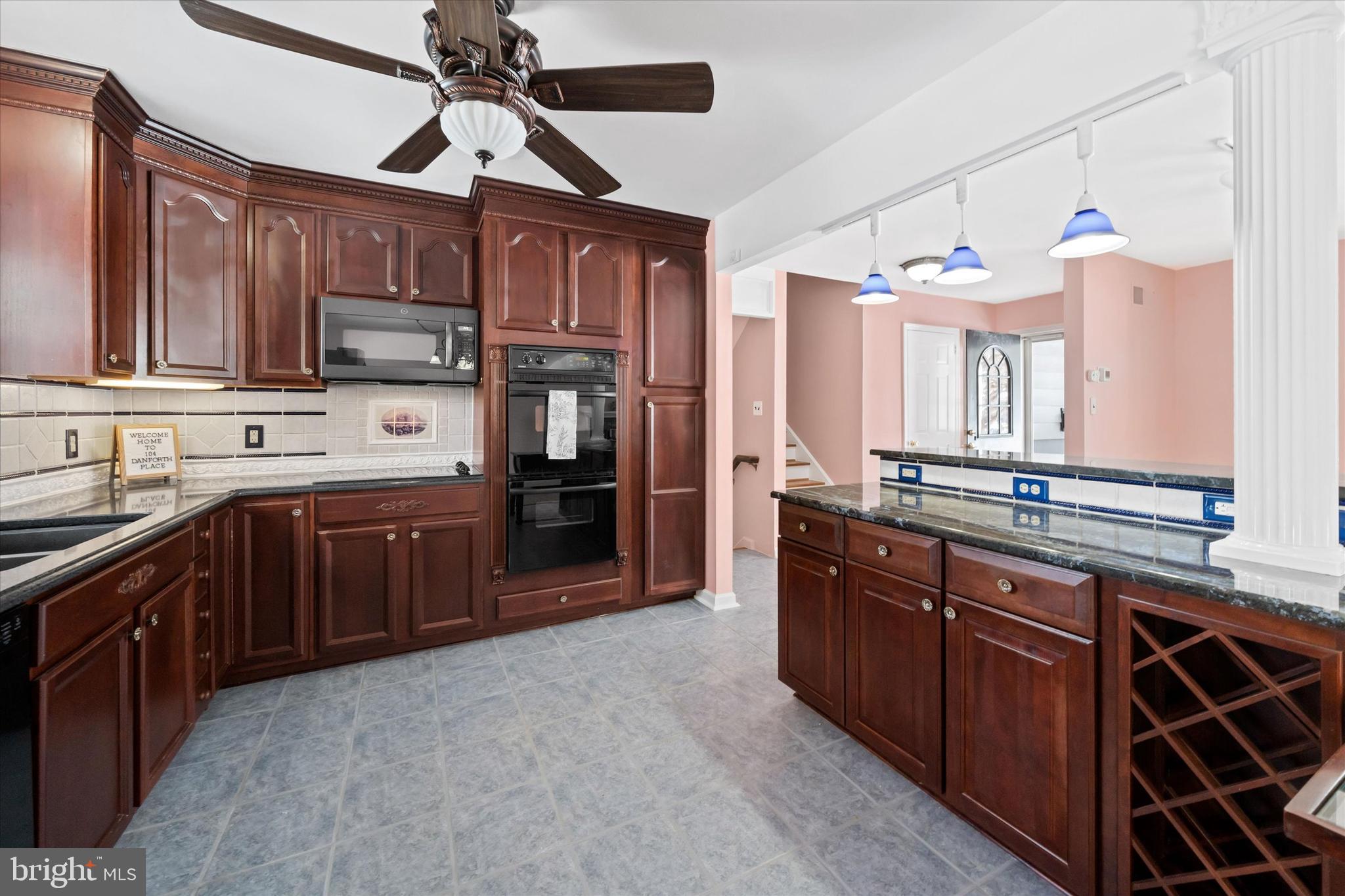 104 Danforth Place Wilmington, DE 19810 - Photo 25 of 53 a kitchen with stainless steel appliances granite countertop wooden cabinets a stove top oven a sink and dishwasher