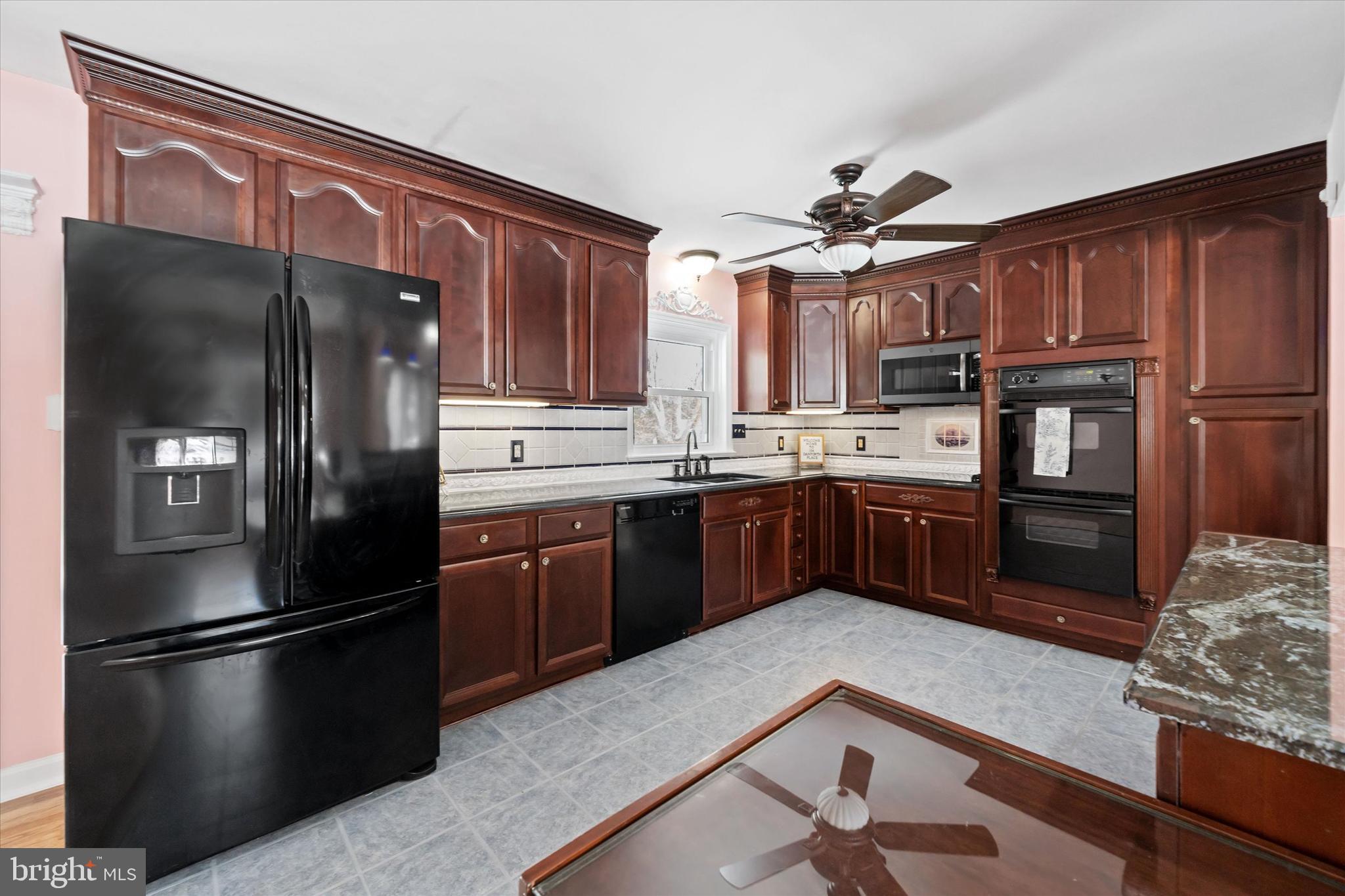 104 Danforth Place Wilmington, DE 19810 - Photo 26 of 53 a kitchen with stainless steel appliances granite countertop a refrigerator a stove and a sink