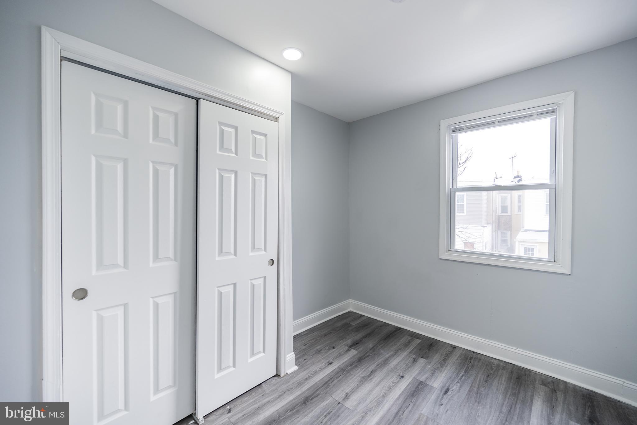 3097 Memphis Street Philadelphia, PA 19134 - Photo 13 of 26 an empty room with wooden floor and a window