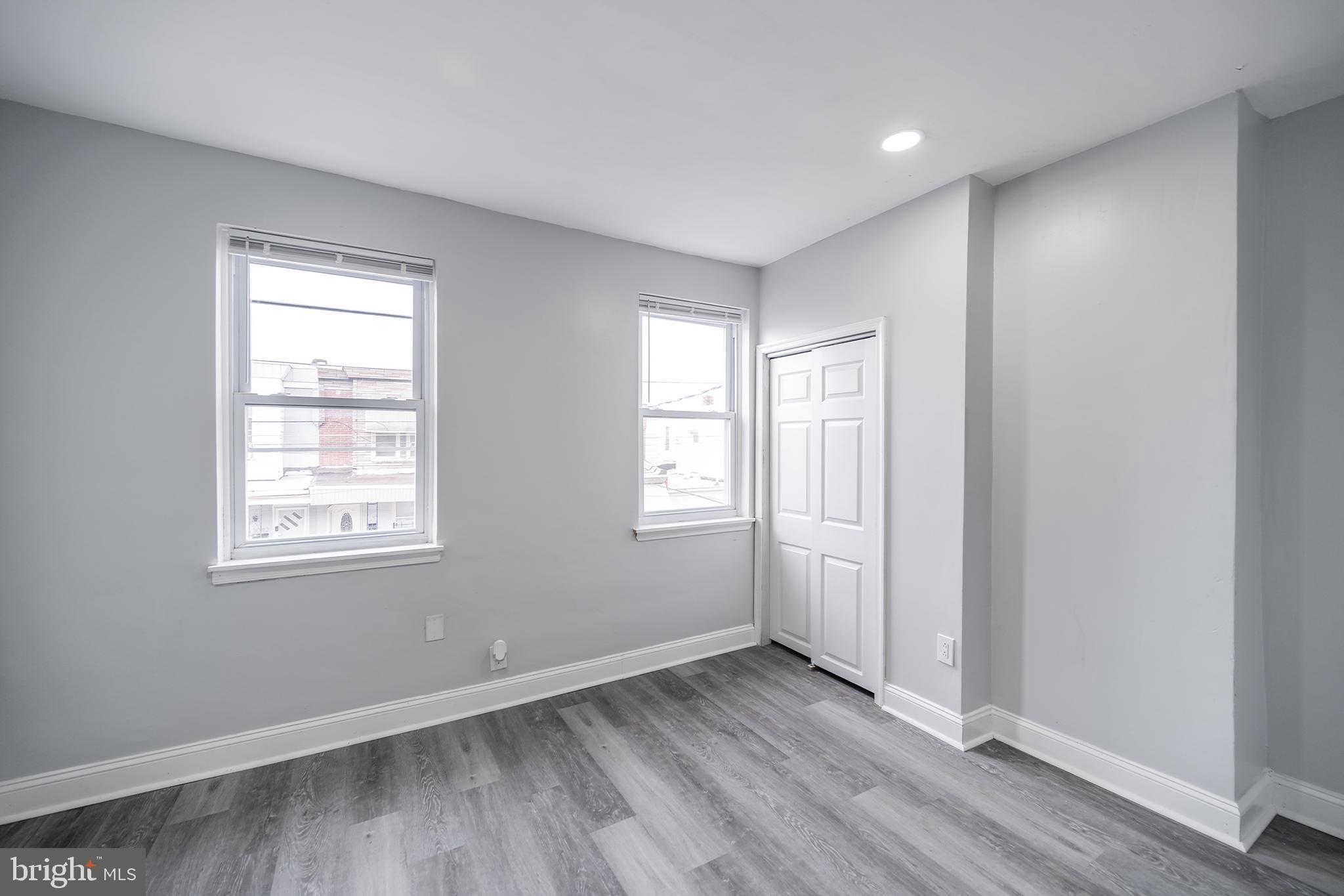 3097 Memphis Street Philadelphia, PA 19134 - Photo 21 of 26 a view of an empty room with wooden floor and a window
