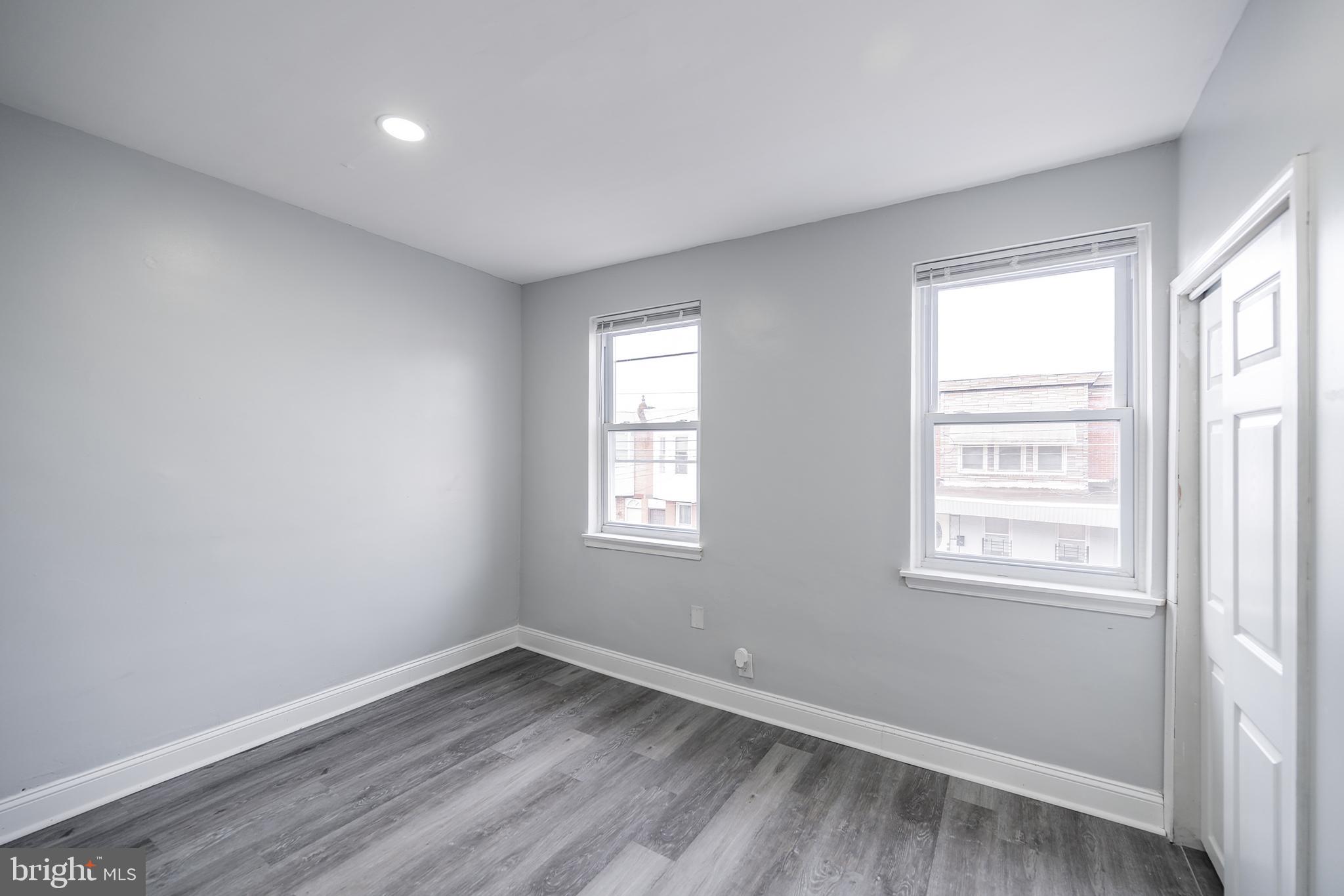 3097 Memphis Street Philadelphia, PA 19134 - Photo 22 of 26 a view of an empty room with wooden floor and a window