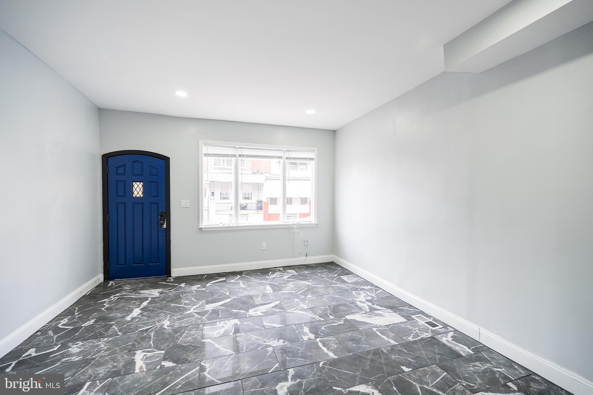 3097 Memphis Street Philadelphia, PA 19134 - Photo 4 of 26 wooden floor in an empty room with a window