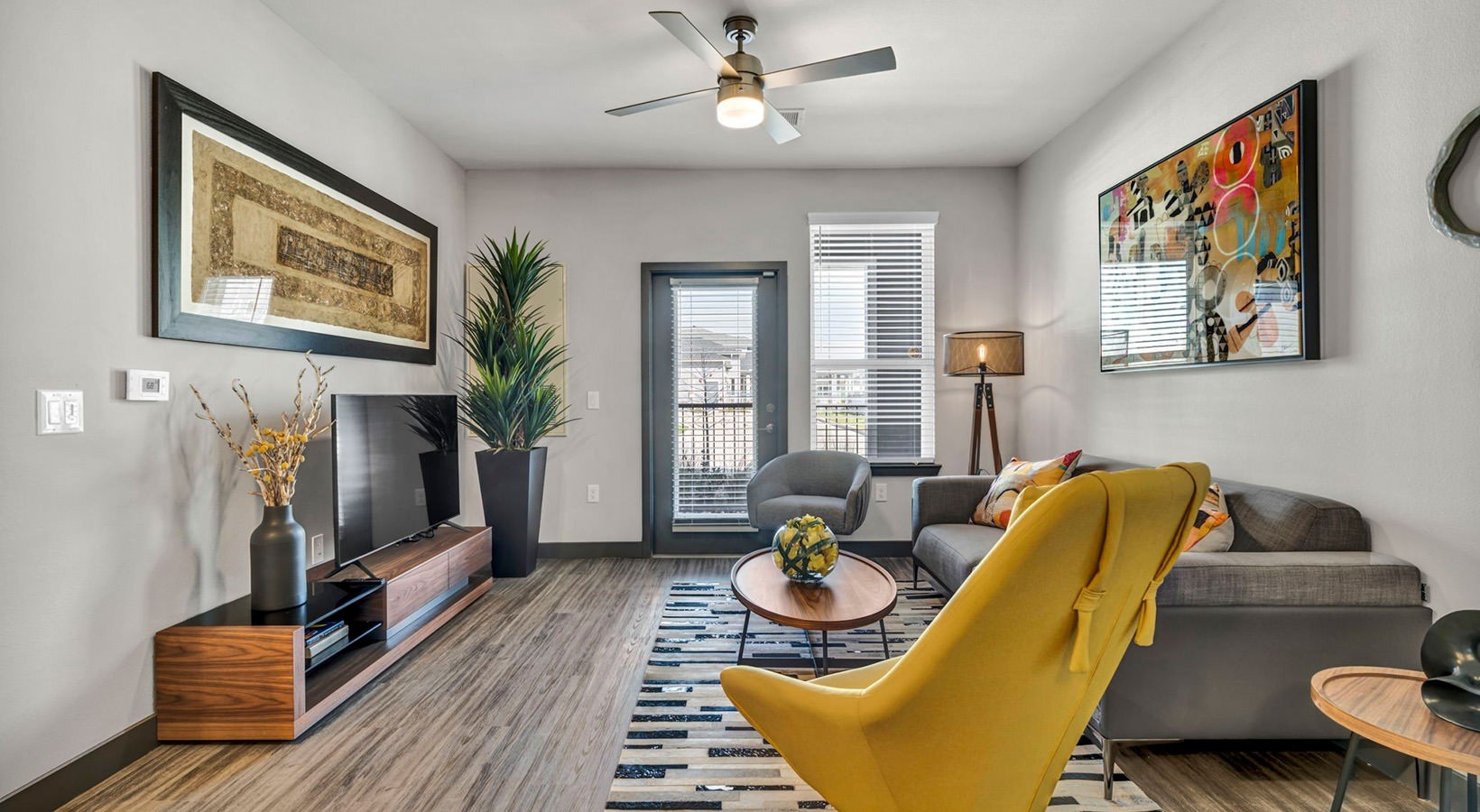 8811 Fm Road, Unit 3306 Richmond, TX 77407 - Photo 1 of 11 a living room with furniture and a flat screen tv