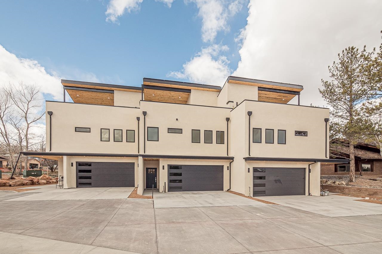 2394 Ridge Cir Drive, Unit B Grand Junction, CO 81507 - Photo 1 of 42 a front view of a house with yard and parking