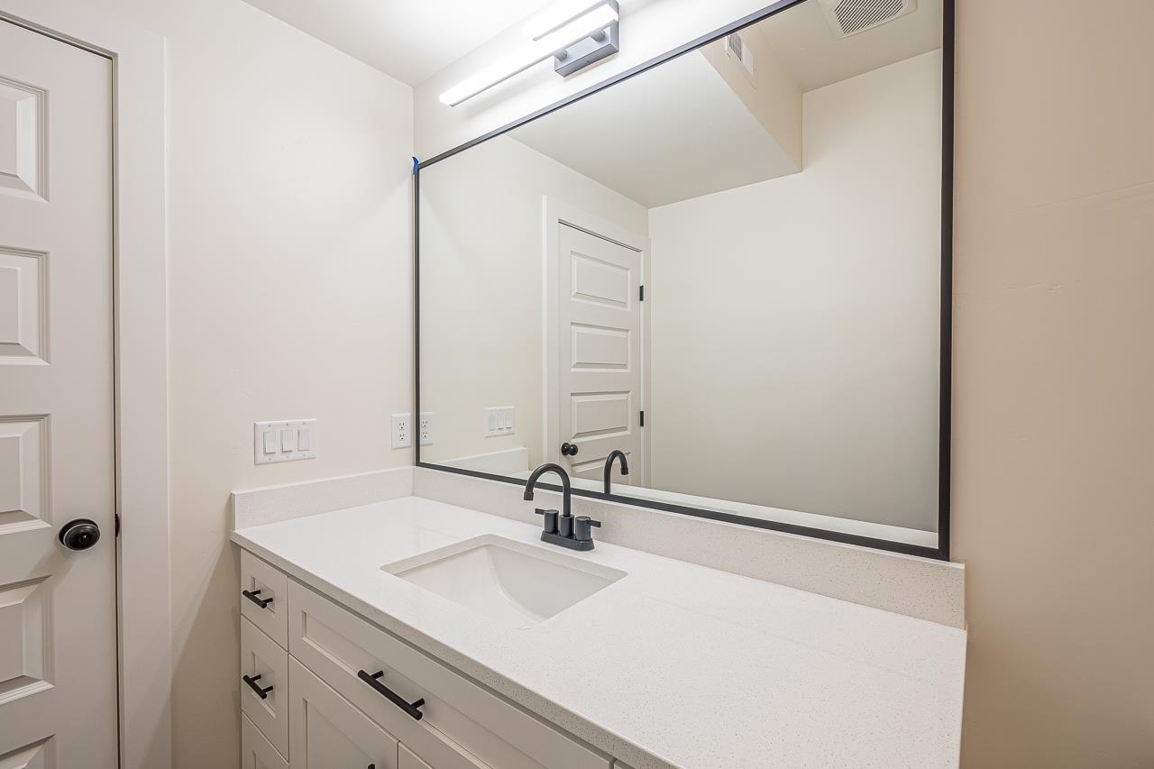 2394 Ridge Cir Drive, Unit B Grand Junction, CO 81507 - Photo 13 of 42 a bathroom with a sink and a mirror