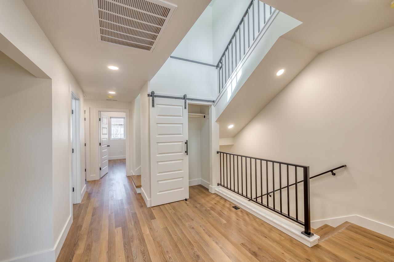 2394 Ridge Cir Drive, Unit B Grand Junction, CO 81507 - Photo 15 of 42 a view of hallway with stairs and wooden floor
