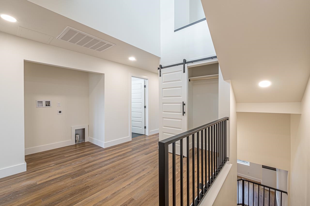 2394 Ridge Cir Drive, Unit B Grand Junction, CO 81507 - Photo 16 of 42 a view of a hallway with closet and wooden floor
