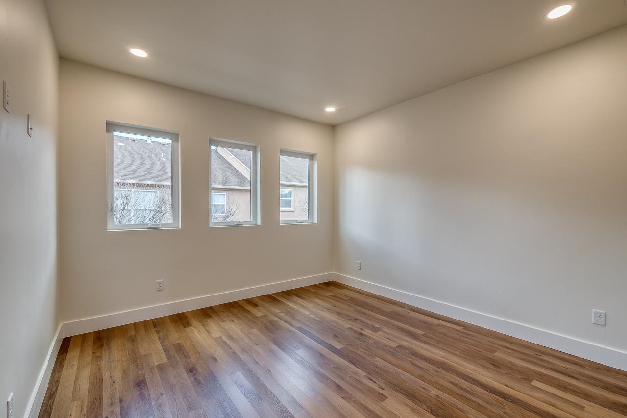 2394 Ridge Cir Drive, Unit B Grand Junction, CO 81507 - Photo 20 of 42 a view of empty room with wooden floor and fan