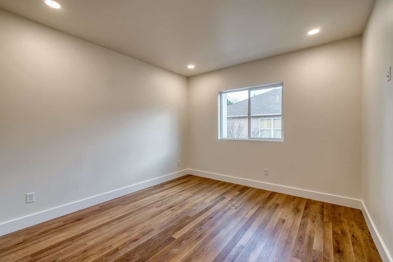 2394 Ridge Cir Drive, Unit B Grand Junction, CO 81507 - Photo 24 of 42 an empty room with wooden floor and windows