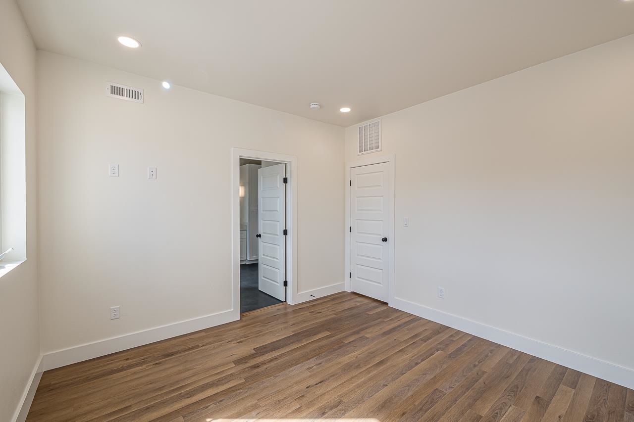 2394 Ridge Cir Drive, Unit B Grand Junction, CO 81507 - Photo 29 of 42 a view of an empty room with wooden floor