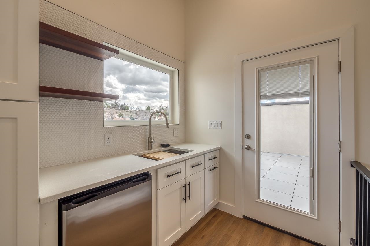 2394 Ridge Cir Drive, Unit B Grand Junction, CO 81507 - Photo 32 of 42 a kitchen with a sink and a window