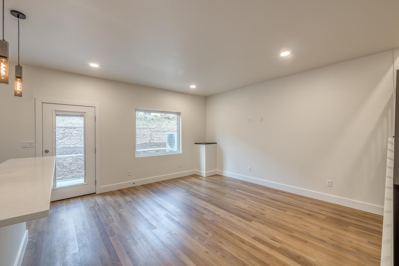 2394 Ridge Cir Drive, Unit B Grand Junction, CO 81507 - Photo 10 of 42 an empty room with wooden floor and windows