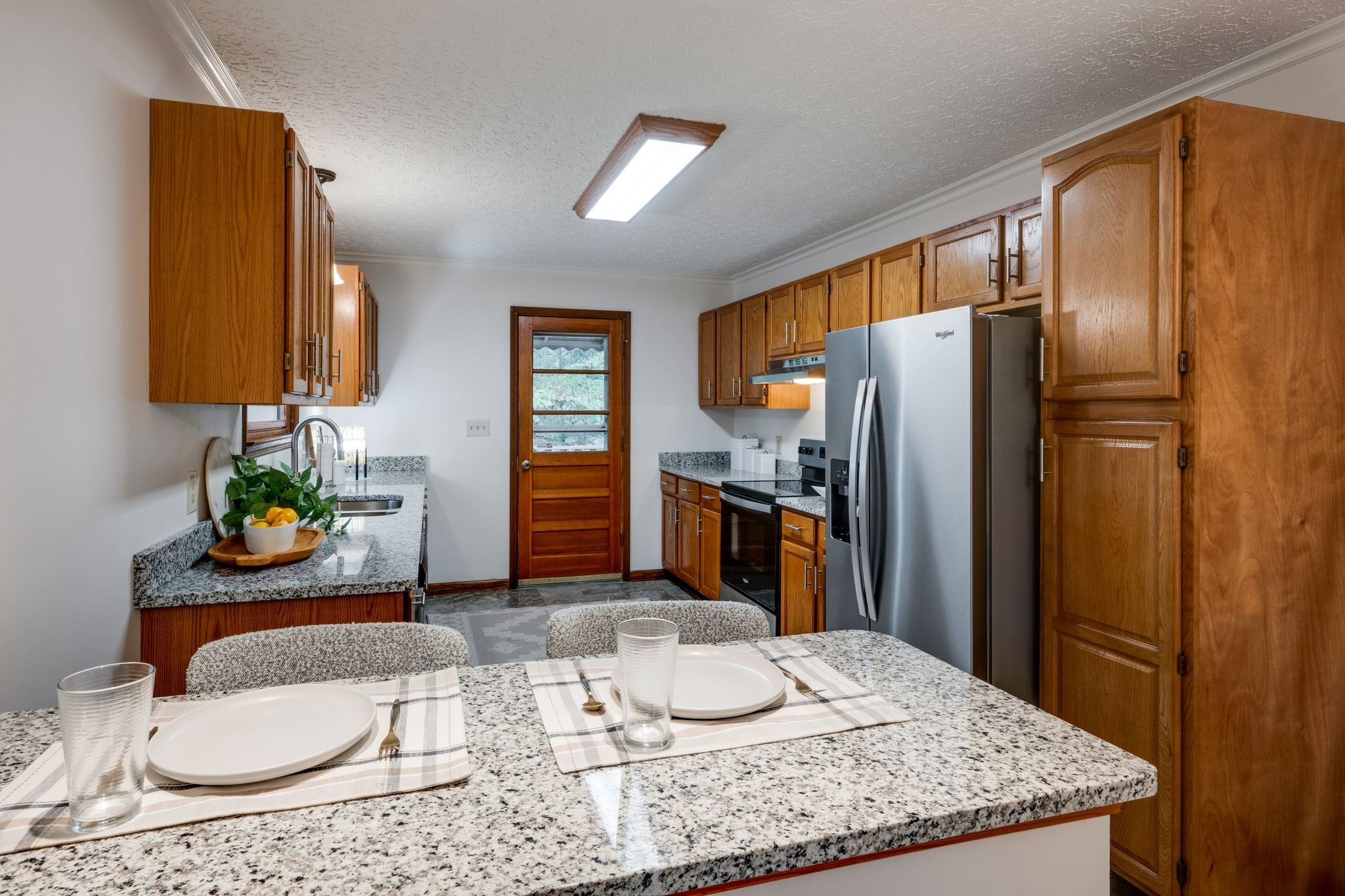 1085 Claylick Road White Bluff, TN 37187 - Photo 11 of 48 a kitchen with stainless steel appliances granite countertop a sink refrigerator and microwave